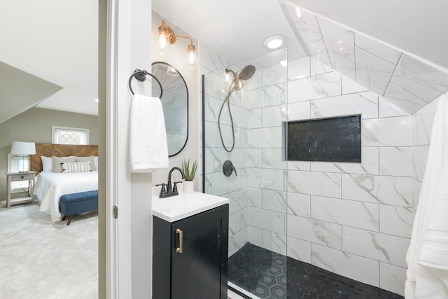 bathroom featuring vanity and a tile shower