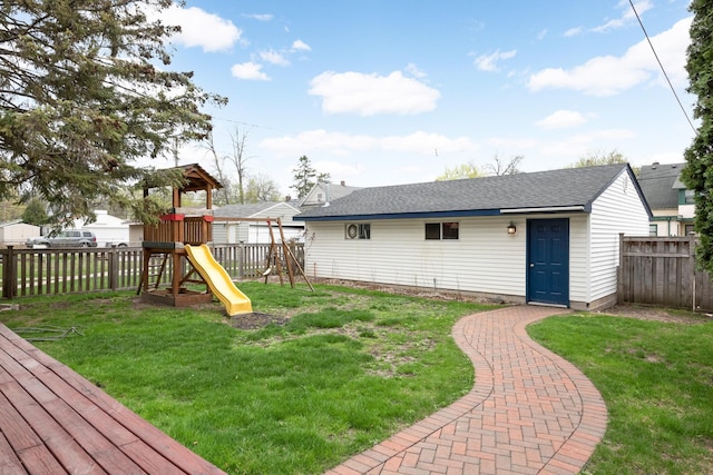 view of yard with an outdoor structure and a playground