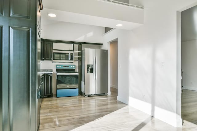 kitchen featuring appliances with stainless steel finishes and light wood-type flooring