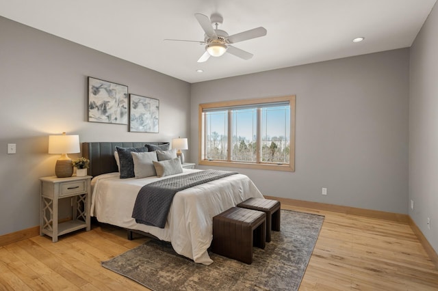 bedroom with light wood-type flooring and ceiling fan