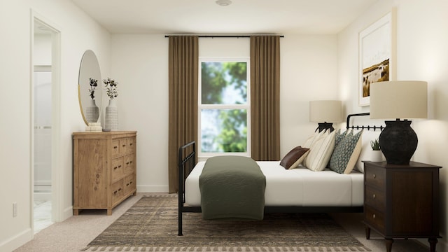 bedroom featuring carpet and ensuite bath