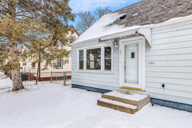 view of snow covered property entrance