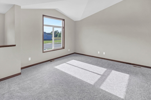 bonus room featuring carpet flooring and vaulted ceiling