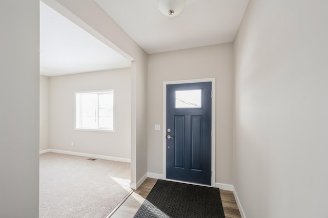 entryway with plenty of natural light and light hardwood / wood-style floors