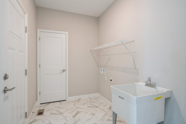 laundry area with sink, hookup for a washing machine, and hookup for an electric dryer