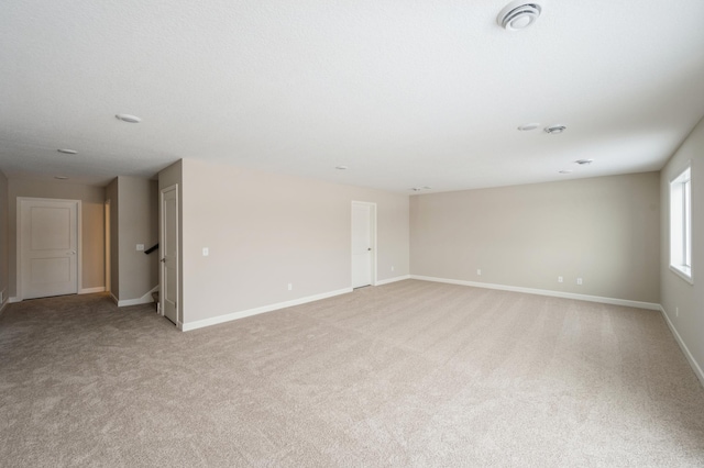 empty room with light colored carpet