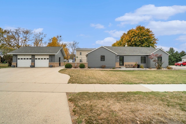 ranch-style house with a garage and a front lawn