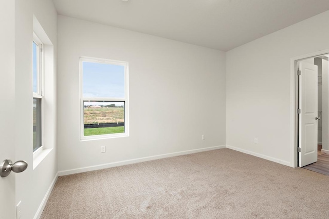 unfurnished room with carpet floors