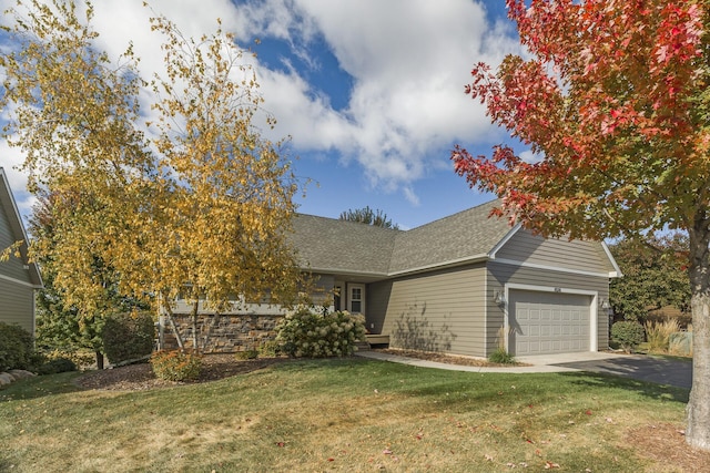 view of front facade with a garage and a front yard