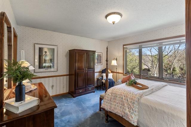 carpeted bedroom featuring a textured ceiling