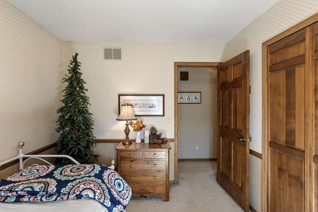 bedroom featuring light colored carpet