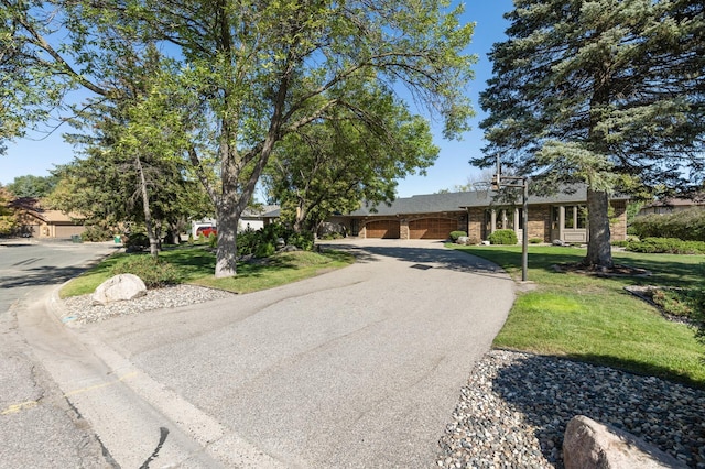 view of front of home featuring a garage and a front yard