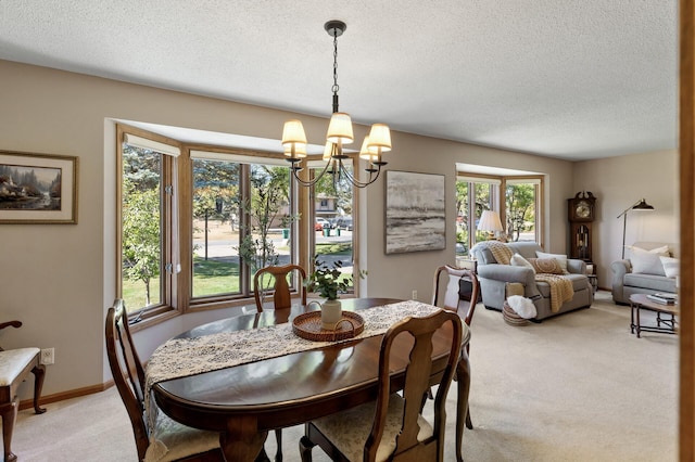 carpeted dining space featuring a textured ceiling and an inviting chandelier