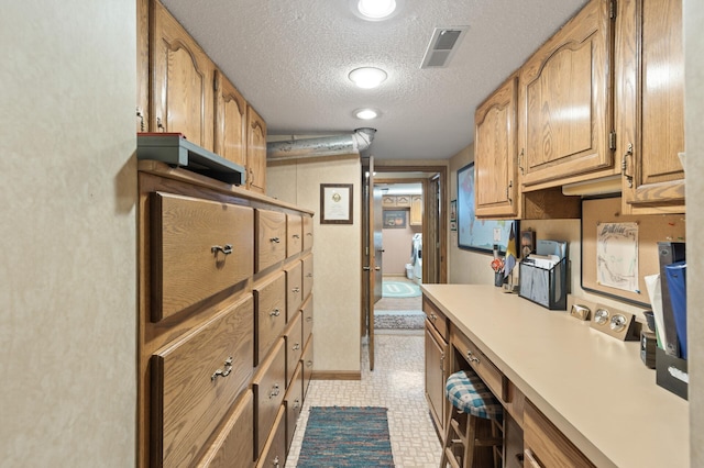 kitchen featuring a textured ceiling