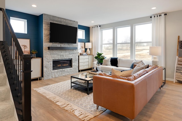 living room with a fireplace and light hardwood / wood-style floors