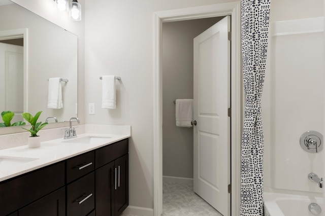 bathroom with vanity and shower / washtub combination