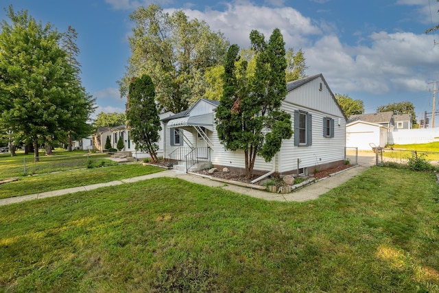 view of side of property with a lawn