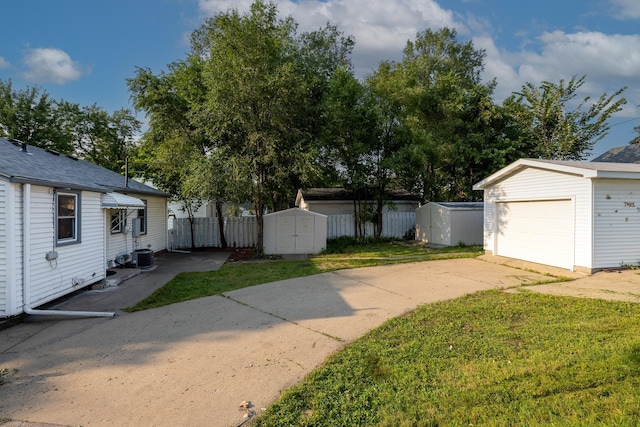 view of yard with a storage unit and central air condition unit