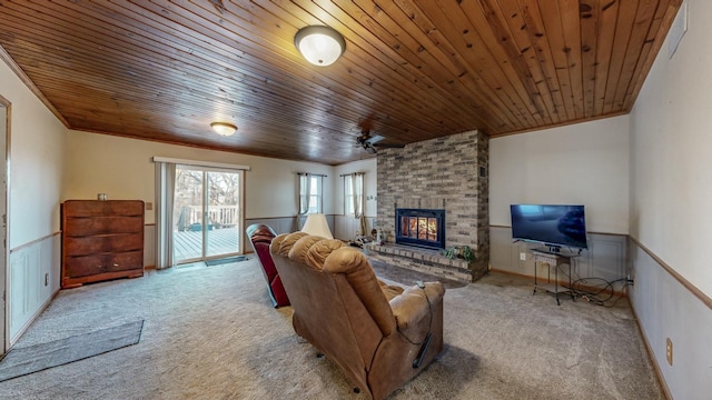 living room with crown molding, a brick fireplace, light carpet, and wood ceiling