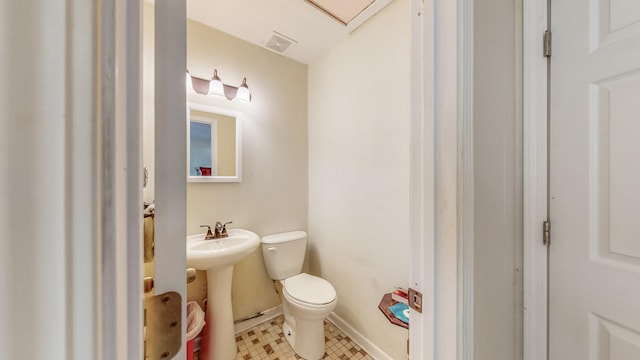 bathroom with sink and toilet