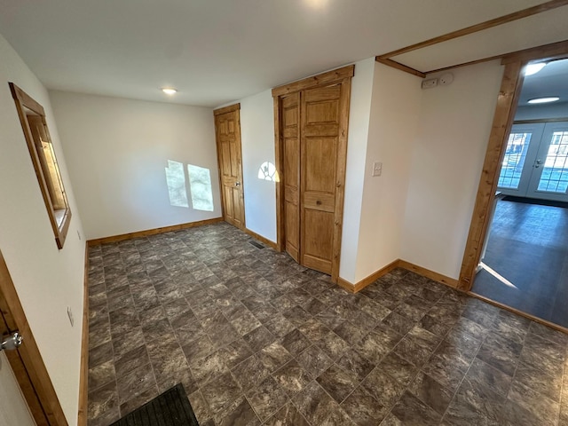 empty room featuring french doors