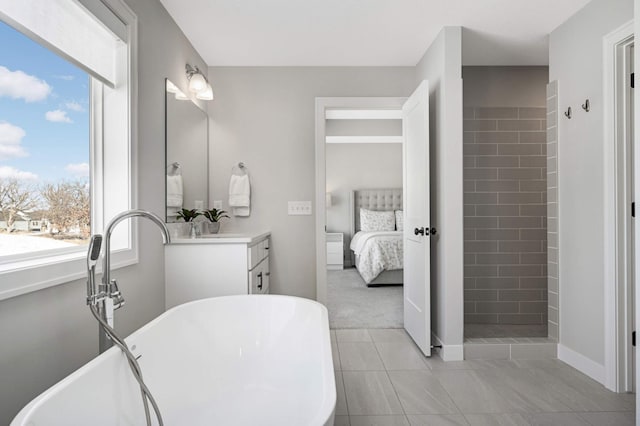 bathroom with vanity and separate shower and tub