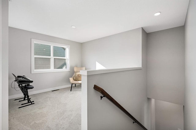 living area with light colored carpet