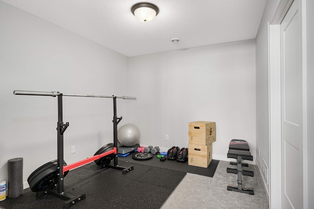 workout area with a textured ceiling