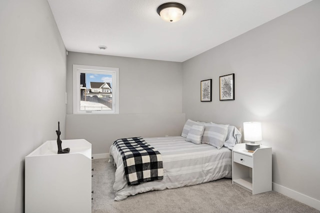 bedroom with light colored carpet