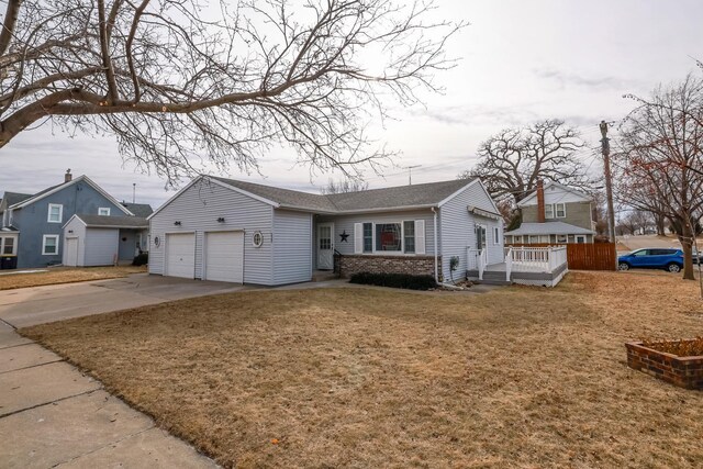 view of front of home with a garage and a front yard