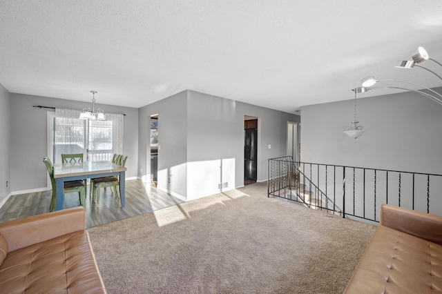 interior space with an inviting chandelier and a textured ceiling