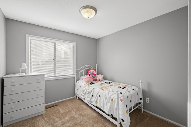 bedroom featuring light colored carpet