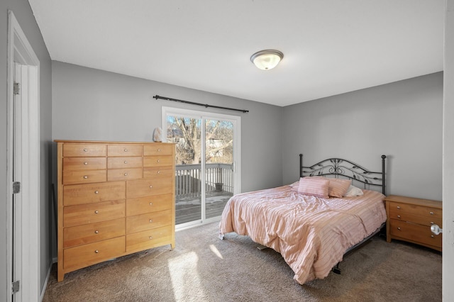 carpeted bedroom featuring access to exterior