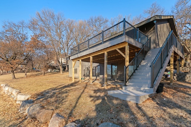 back of house with a wooden deck