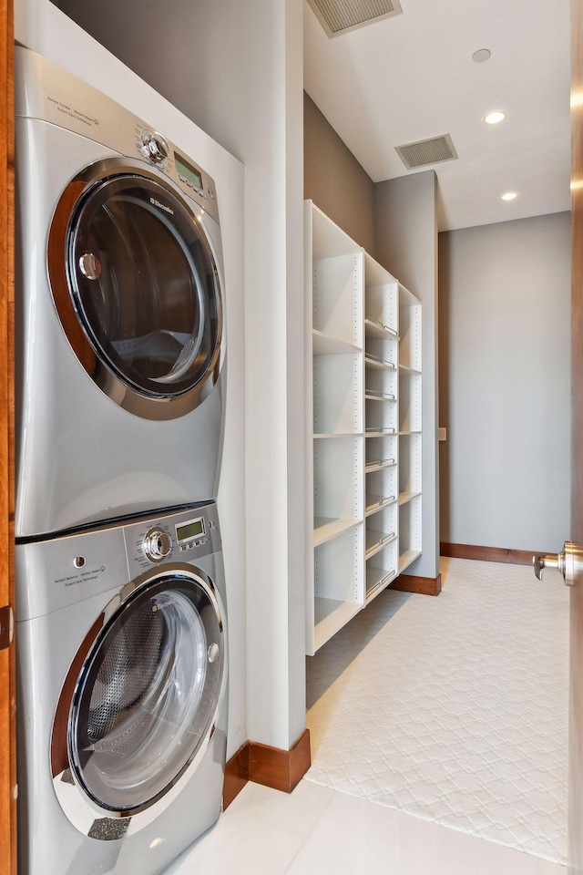 201 11th St Unit 2600, Minneapolis, MN 55403 - laundry area with stacked washing machine and dryer, recessed lighting, and baseboards