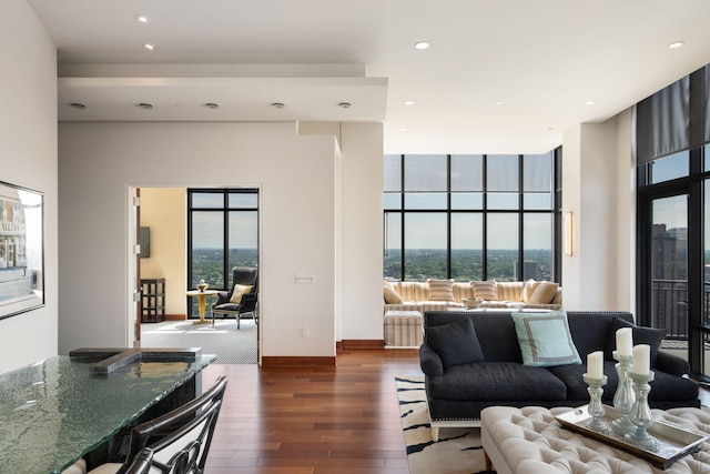 201 11th St Unit 2600, Minneapolis, MN 55403 - living room featuring hardwood / wood-style floors, healthy amount of natural light, recessed lighting, and a towering ceiling