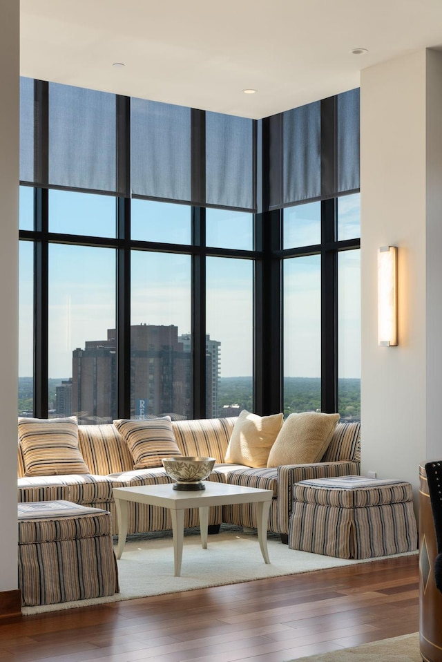 201 11th St Unit 2600, Minneapolis, MN 55403 - living area featuring a wall of windows, a towering ceiling, healthy amount of natural light, and wood finished floors