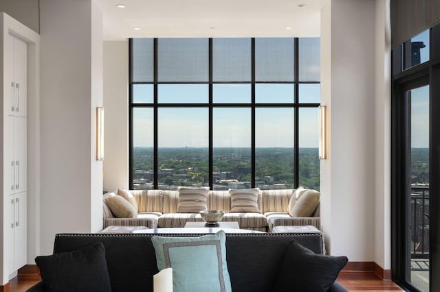 201 11th St Unit 2600, Minneapolis, MN 55403 - living room featuring a towering ceiling, wood finished floors, expansive windows, and recessed lighting