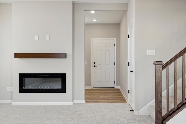 view of carpeted foyer