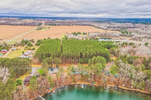 birds eye view of property featuring a water view and a rural view