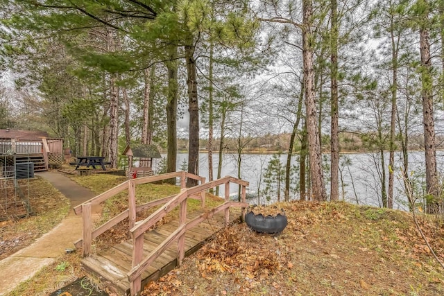 view of yard featuring a deck with water view