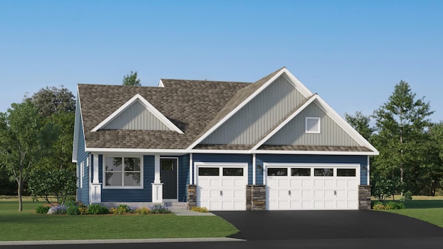 craftsman-style house featuring a garage and a front yard