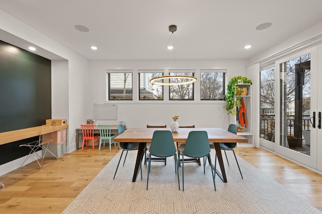 dining room with recessed lighting and wood finished floors