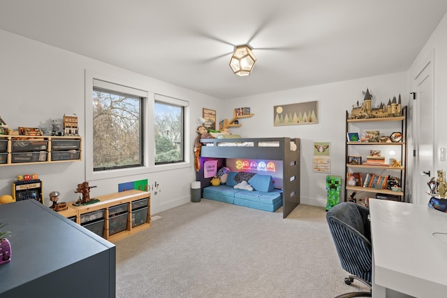 carpeted bedroom featuring baseboards