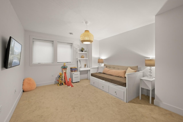 bedroom featuring baseboards and light colored carpet