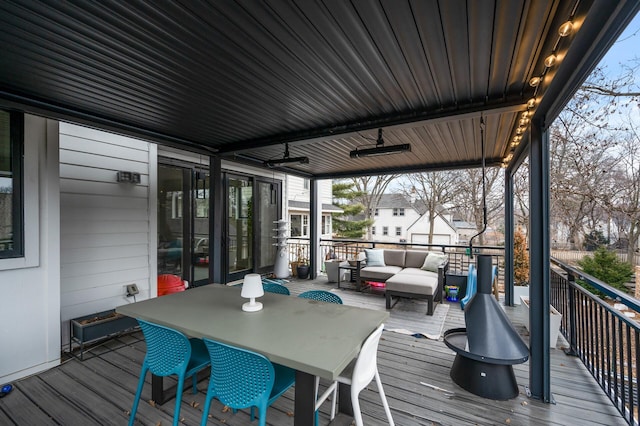 wooden terrace with outdoor lounge area