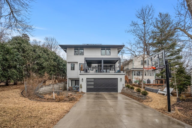 view of front of home with an attached garage and concrete driveway