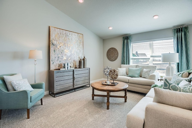 carpeted living room with lofted ceiling