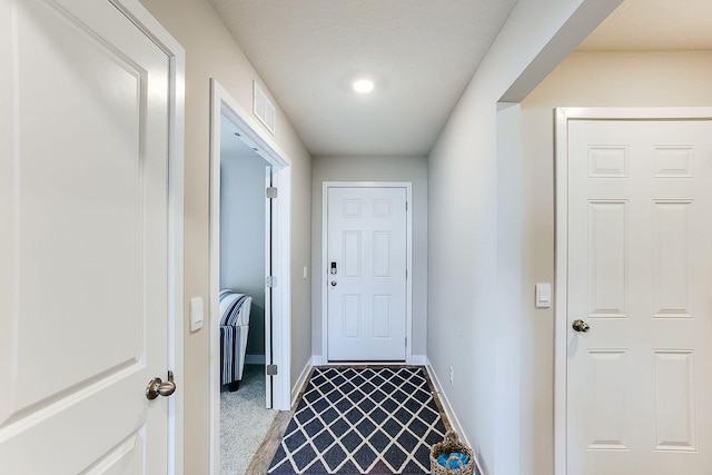 entryway featuring carpet floors