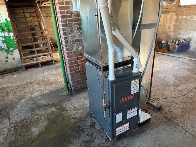 utility room featuring heating unit